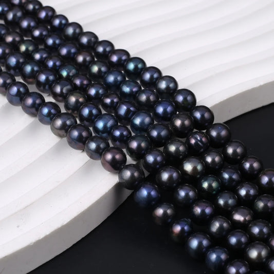 Fil de perles noires d'eau douce naturelles